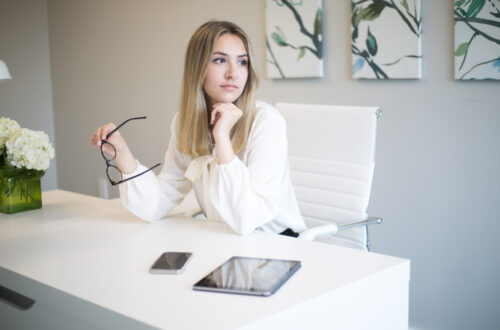 Woman At Desk With Tablet and Phone Free Stock Picture