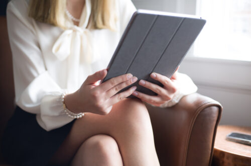 Woman Looking At Tablet Free Stock Picture